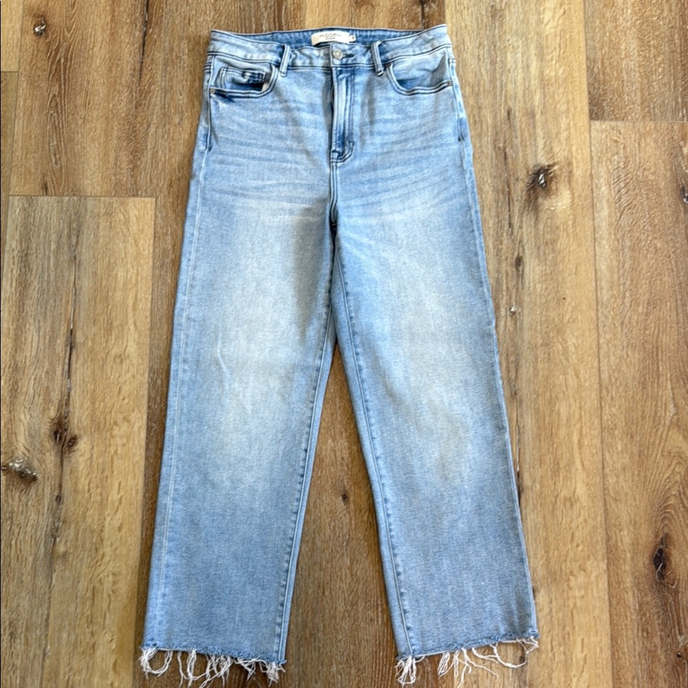 Light Blue Straight Leg Jeans with Distressed Hem